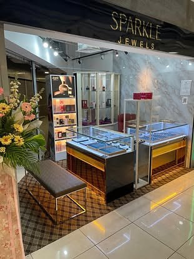 Customers browsing the lit display cases