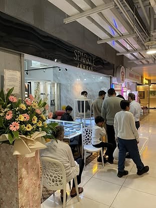 The shop on its opening day, customers seated at the counter