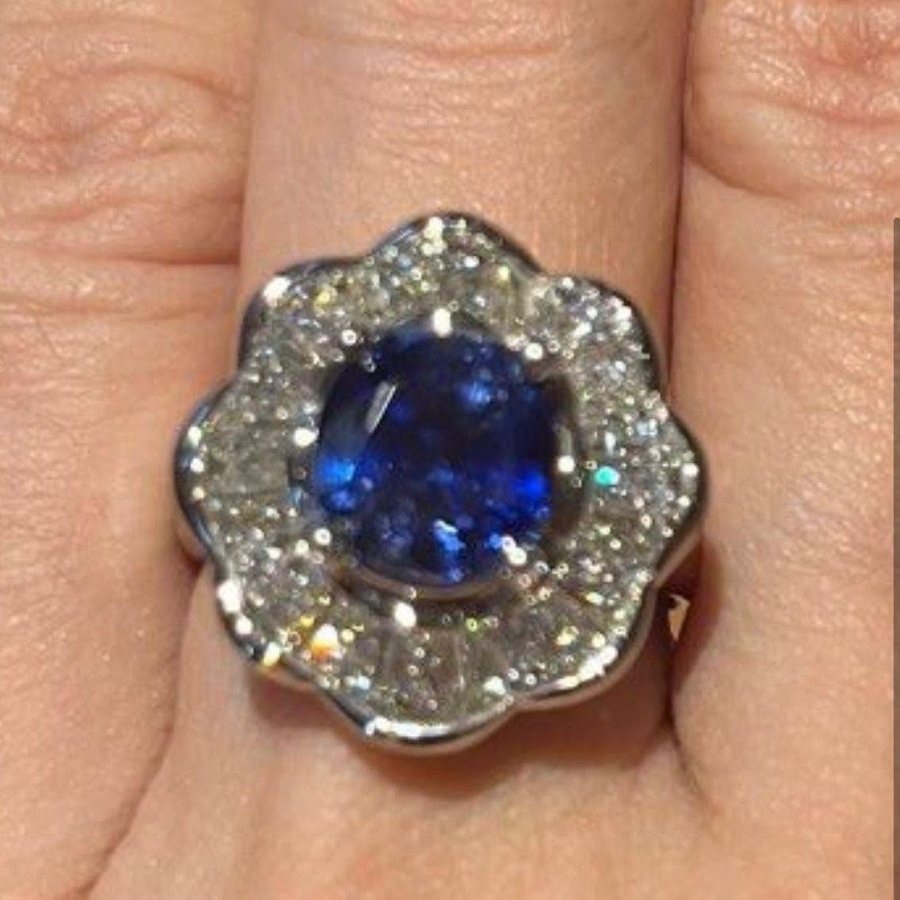 Blue sapphire cluster ring with diamond petals